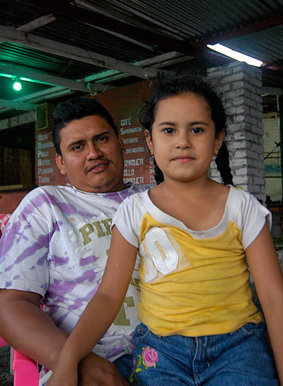 Nicaraguans in Playa Santo Domingo posing for a picture.  They smile until the moment that they pose - then the serious looks come out.