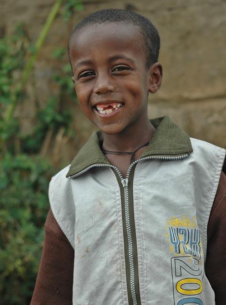 Yet another smiling beggar kid.