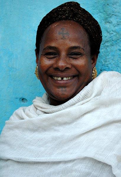 Woman in Gonder with crosses tatooed on her forehead and chin.