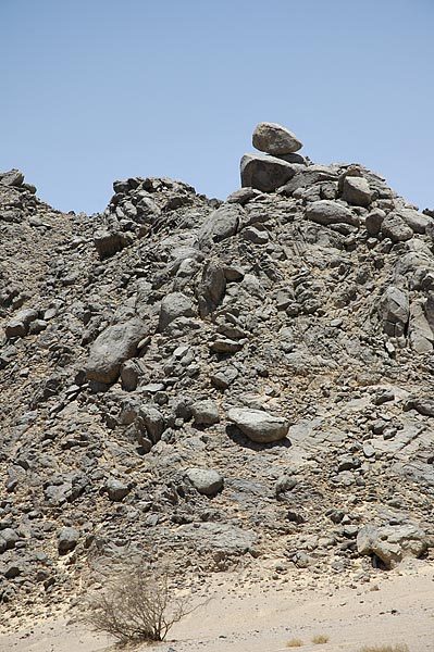 Views from the Bus - Wind Erosion - How long has that boulder been balanced there.