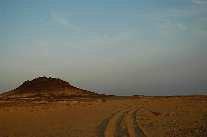 The sun is going down and we're still heading through the middle of the Sahara.