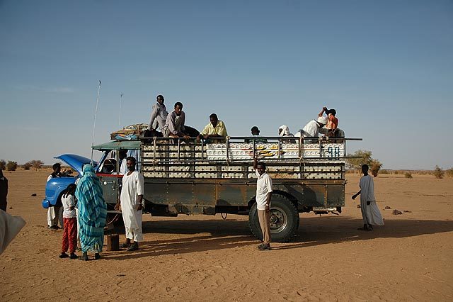 Sudanese truck rides - after 6 hours of traveling through the middle of the desert we stop at midnight and sleep in the sand.  First thing in the morning we continued on our way.