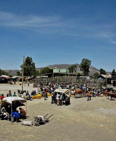 Passing through another village.  There is a huge line waiting for water.