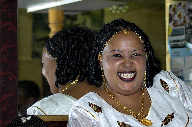 The cashier at the National Hotel's bar, dressed up for the end of Lent.  Some of the prostitutes are big, but not quite this big.