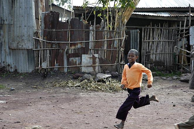 Running is the national sport of Ethiopia.  (Many of the top marathoners in the world are Ethiopian.)  I'd often see barefoot boys running beside the train.