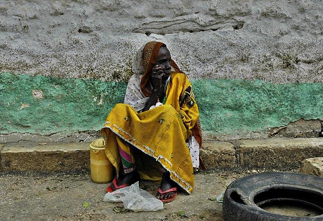 I believe that this solitary woman was selling butter (handmade of course).