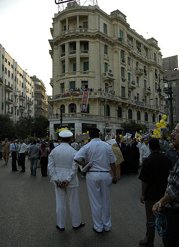 Police watching a protest at Talat Harb square in Cairo.